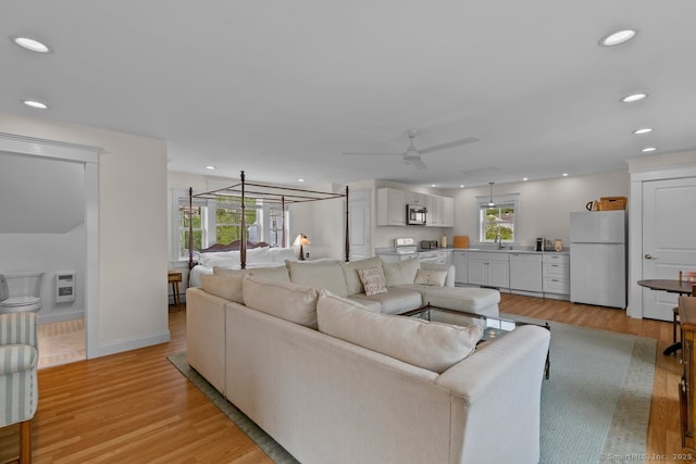 2 Ashby St, Groton, CT 06355 - living room with light wood-type flooring, recessed lighting, ceiling fan, and heating unit