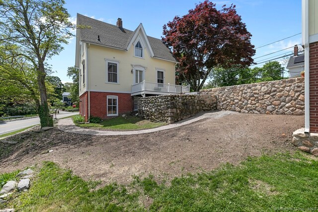 2 Ashby St, Groton, CT 06355 - rear view of house with a chimney, a shingled roof, and brick siding