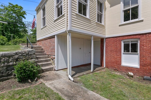 2 Ashby St, Groton, CT 06355 - view of exterior entry featuring brick siding