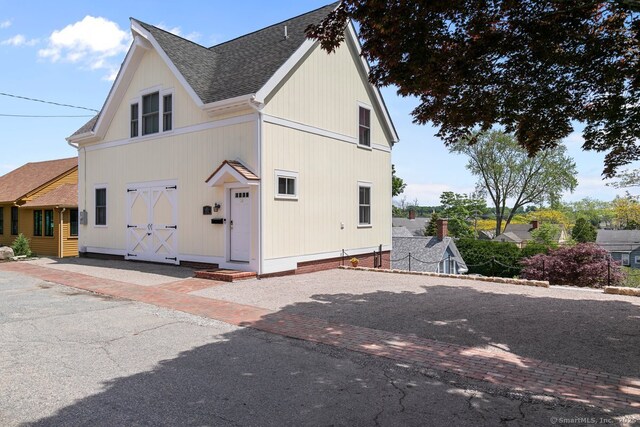 2 Ashby St, Groton, CT 06355 - view of side of property featuring a shingled roof