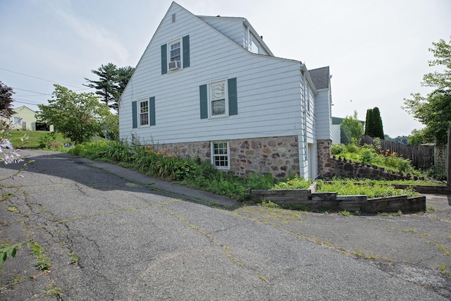 53 Haviland St, Bristol, CT 06010 - view of side of home featuring stone siding