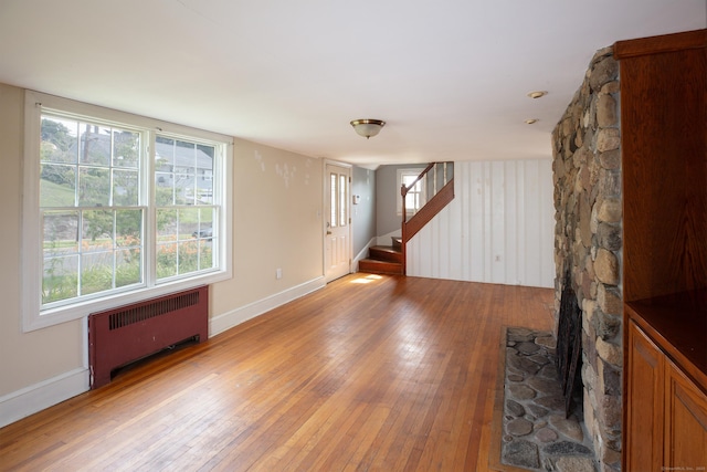 53 Haviland St, Bristol, CT 06010 - spare room with radiator, hardwood / wood-style flooring, and stairway