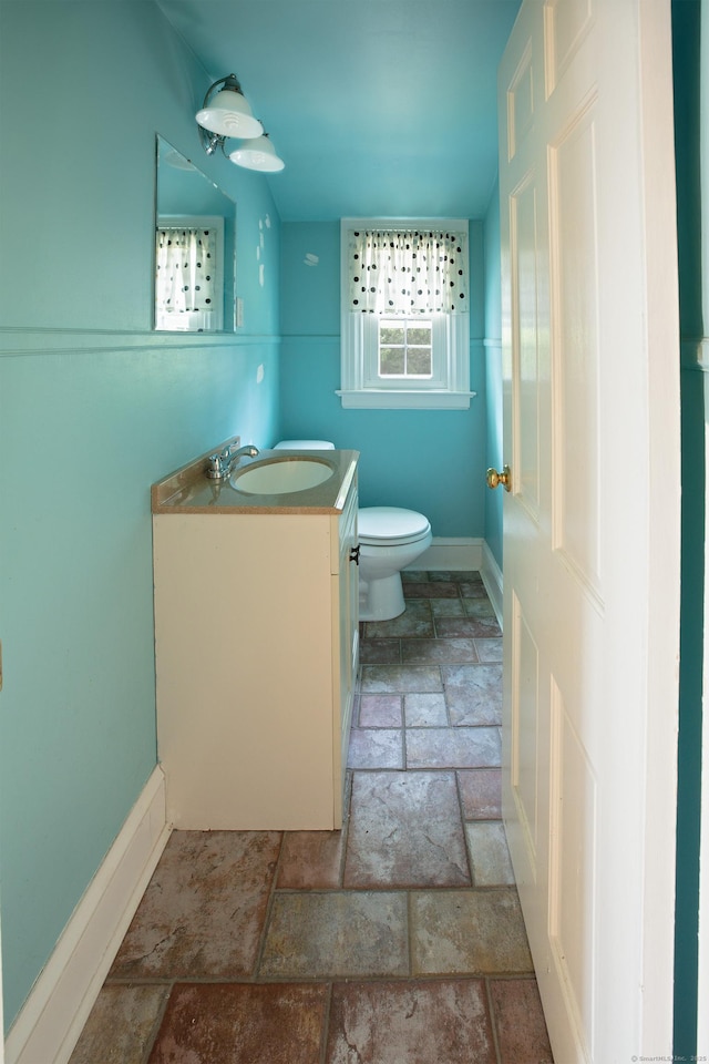 53 Haviland St, Bristol, CT 06010 - half bath featuring stone tile floors and vanity