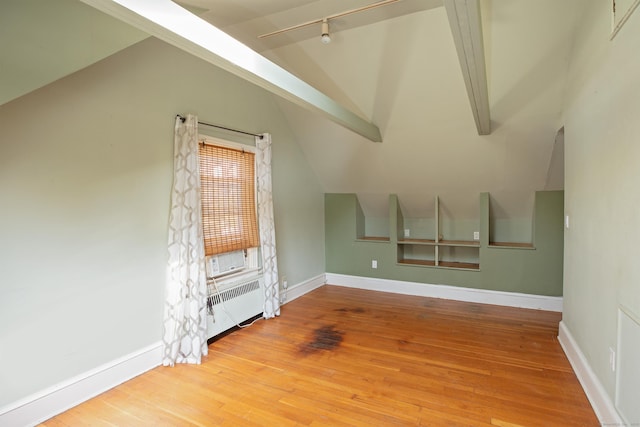 53 Haviland St, Bristol, CT 06010 - unfurnished living room featuring radiator heating unit, hardwood / wood-style flooring, and track lighting