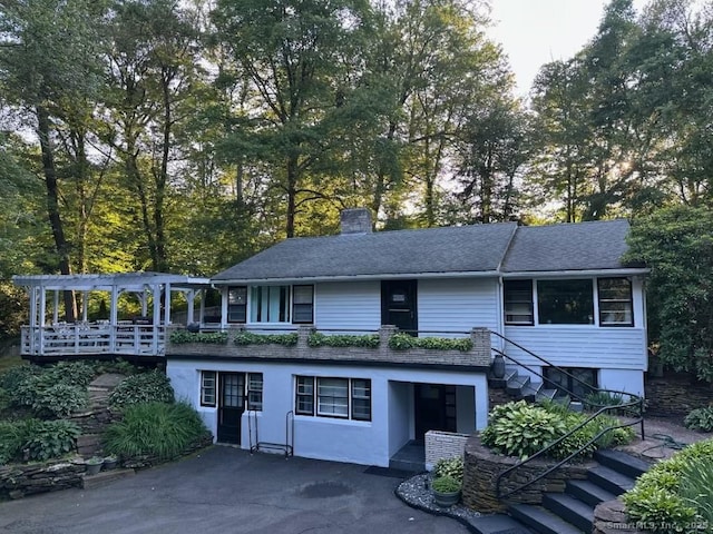 5 Old Orchard Rd, Bloomfield, CT 06002 - view of front of home with stairs, a chimney, and roof with shingles