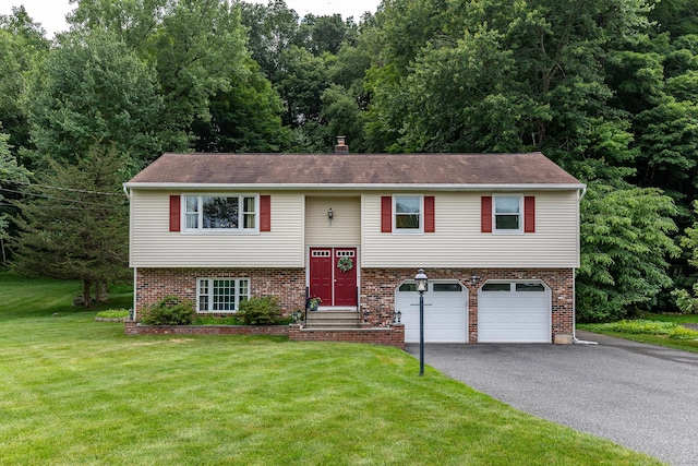 28 Musket Ridge Rd, New Fairfield, CT 06812 - split foyer home featuring asphalt driveway, a garage, a front lawn, a chimney, and brick siding