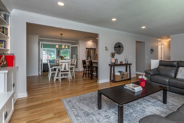 28 Musket Ridge Rd, New Fairfield, CT 06812 - living room with ornamental molding, light wood-style flooring, recessed lighting, and a chandelier
