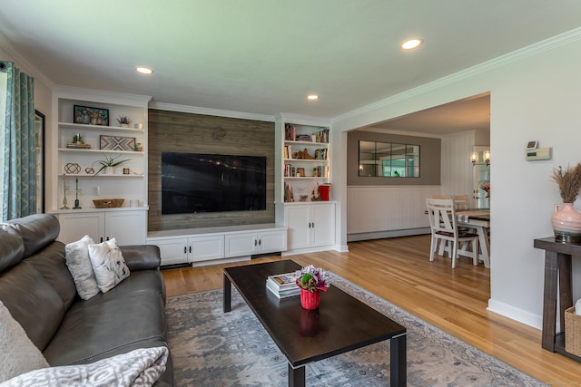 28 Musket Ridge Rd, New Fairfield, CT 06812 - living room featuring light wood finished floors, built in shelves, a baseboard heating unit, ornamental molding, and recessed lighting