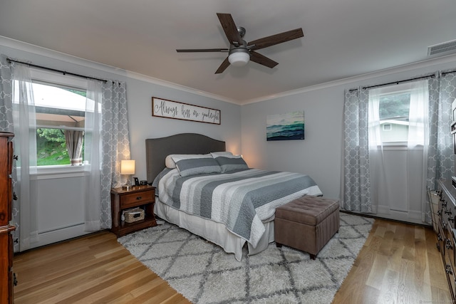 28 Musket Ridge Rd, New Fairfield, CT 06812 - bedroom featuring a baseboard heating unit, wood finished floors, crown molding, and a ceiling fan