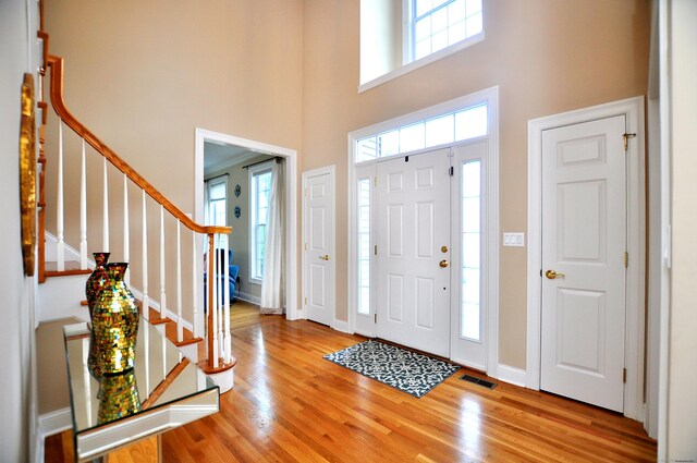 32 Arlington Dr, Avon, CT 06001 - entryway featuring a high ceiling, wood finished floors, and stairway