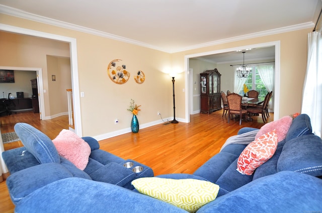 32 Arlington Dr, Avon, CT 06001 - living room with wood finished floors, a chandelier, and ornamental molding