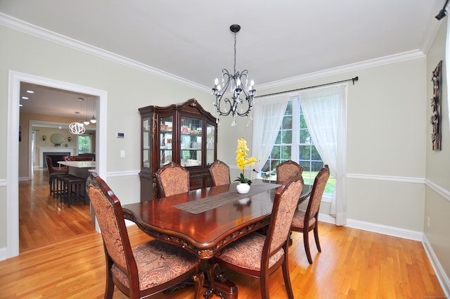 32 Arlington Dr, Avon, CT 06001 - dining area featuring a chandelier, healthy amount of natural light, light wood-type flooring, and ornamental molding