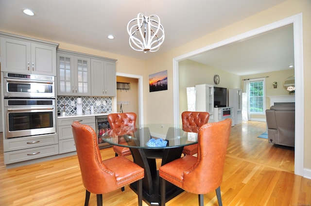 32 Arlington Dr, Avon, CT 06001 - dining room with a chandelier, beverage cooler, light wood finished floors, and recessed lighting