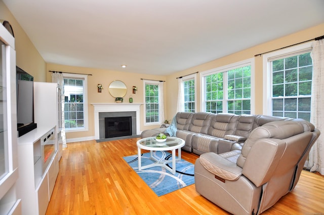32 Arlington Dr, Avon, CT 06001 - living room featuring light wood-style floors and a fireplace with flush hearth