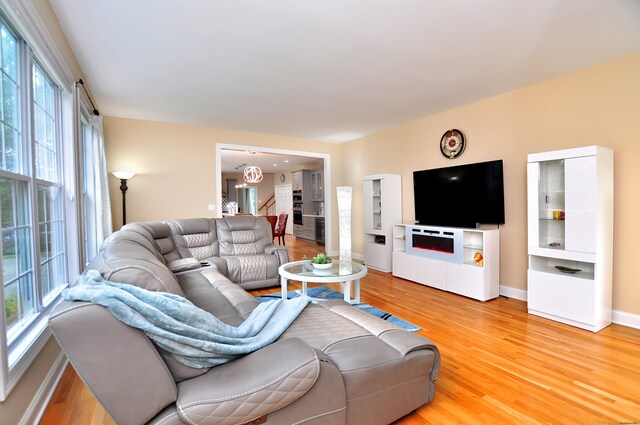 32 Arlington Dr, Avon, CT 06001 - living room with light wood-style floors and baseboards
