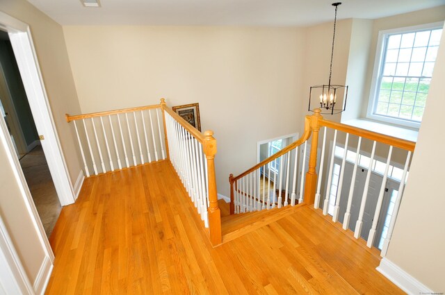 32 Arlington Dr, Avon, CT 06001 - stairway featuring wood finished floors and a chandelier
