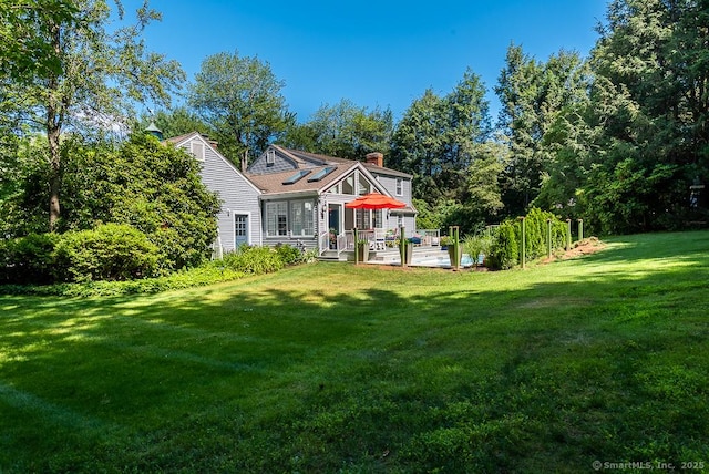 6 Trolley Xing, Old Saybrook, CT 06475 - rear view of house with a yard and a chimney
