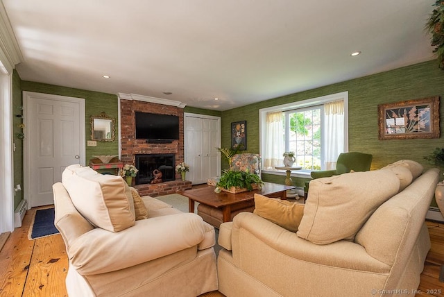 6 Trolley Xing, Old Saybrook, CT 06475 - living room with wallpapered walls, baseboard heating, light wood-style floors, a brick fireplace, and recessed lighting
