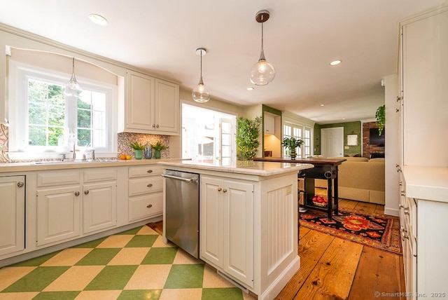 6 Trolley Xing, Old Saybrook, CT 06475 - kitchen with stainless steel dishwasher, plenty of natural light, light countertops, a center island, and recessed lighting