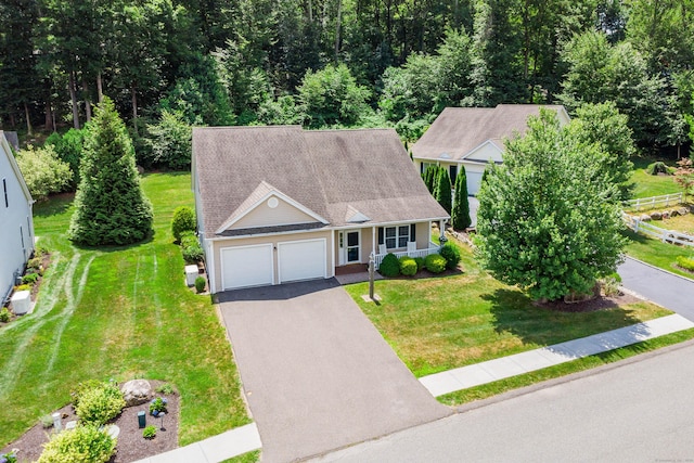 199 Meadow Brook Rd Unit 199, Oxford, CT 06478 - view of front facade featuring covered porch, asphalt driveway, a garage, a front yard, and roof with shingles
