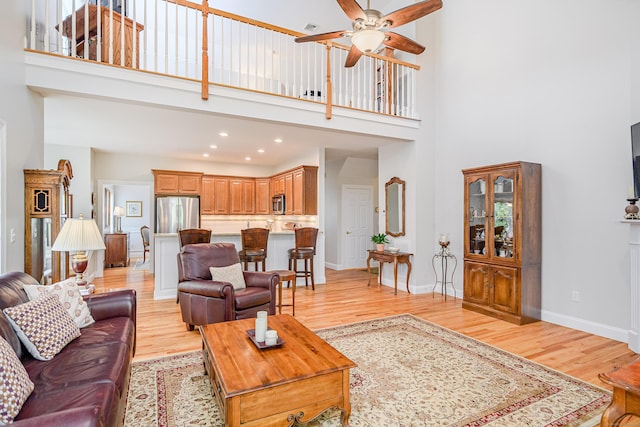 199 Meadow Brook Rd Unit 199, Oxford, CT 06478 - living room featuring light wood-type flooring, ceiling fan, a high ceiling, and recessed lighting