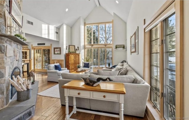 32 Meeks Point Rd, East Hampton, CT 06424 - living area with high vaulted ceiling, hardwood / wood-style floors, healthy amount of natural light, wainscoting, and beamed ceiling