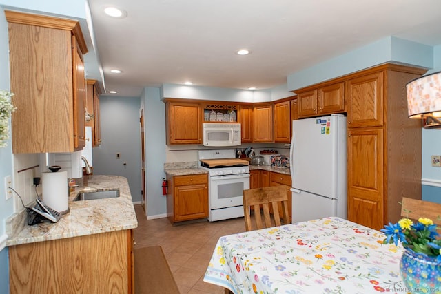2 Oak Ter, Stratford, CT 06614 - kitchen with white appliances, light tile patterned floors, open shelves, brown cabinetry, and recessed lighting