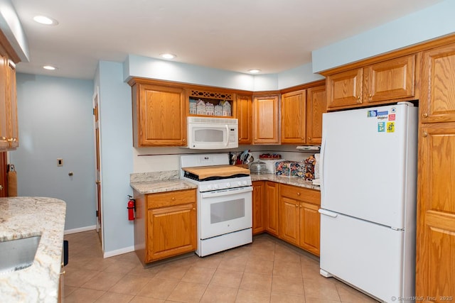 2 Oak Ter, Stratford, CT 06614 - kitchen with white appliances, light tile patterned floors, recessed lighting, open shelves, and light stone counters