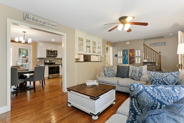 630 Fairview Ave, Bridgeport, CT 06606 - living area featuring ceiling fan, stairs, dark wood-style floors, and a chandelier