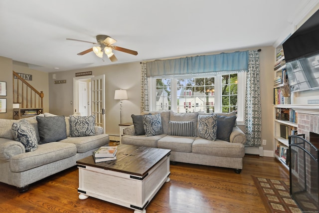 630 Fairview Ave, Bridgeport, CT 06606 - living room featuring a ceiling fan, baseboard heating, stairway, and dark wood-type flooring