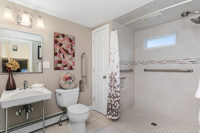 630 Fairview Ave, Bridgeport, CT 06606 - full bath featuring a baseboard radiator, a stall shower, and tile patterned floors