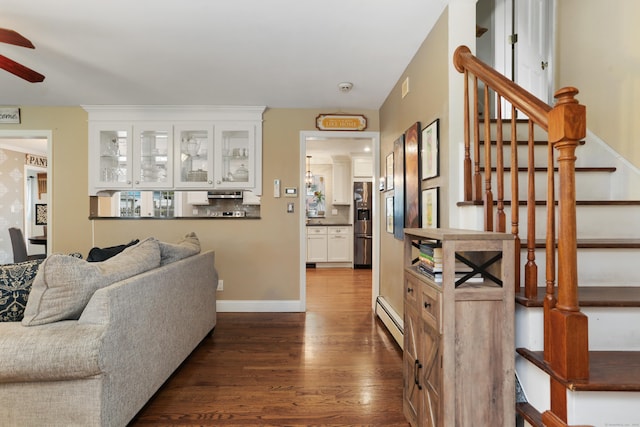 630 Fairview Ave, Bridgeport, CT 06606 - living room featuring ceiling fan, stairway, dark wood-style floors, and baseboard heating