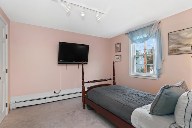 630 Fairview Ave, Bridgeport, CT 06606 - bedroom with baseboard heating, light colored carpet, and rail lighting