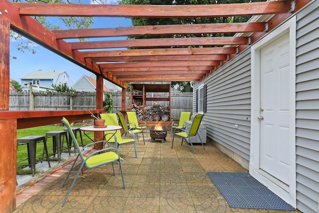 630 Fairview Ave, Bridgeport, CT 06606 - fenced backyard with an outdoor fire pit, a patio area, and a pergola