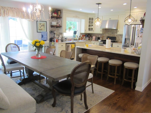 21 Kingswood Rd, Danbury, CT 06811 - dining area featuring a chandelier, dark wood finished floors, recessed lighting, and crown molding
