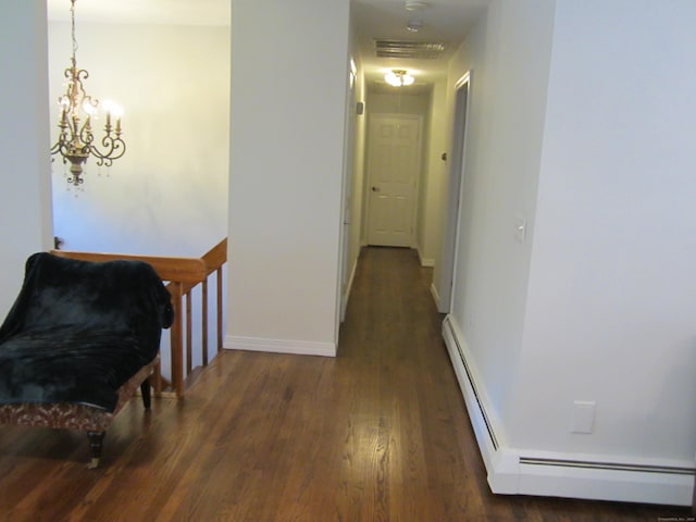 21 Kingswood Rd, Danbury, CT 06811 - corridor featuring wood finished floors, a baseboard radiator, and a chandelier