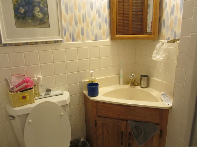 21 Kingswood Rd, Danbury, CT 06811 - bathroom featuring vanity, backsplash, wallpapered walls, and tile walls