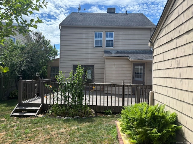 954 Birmingham St, Bridgeport, CT 06606 - rear view of property with a deck, a lawn, roof with shingles, and a chimney