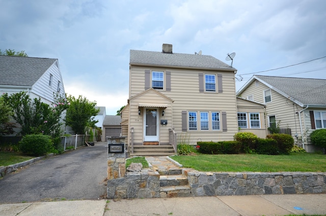 954 Birmingham St, Bridgeport, CT 06606 - view of front facade featuring a chimney and a garage