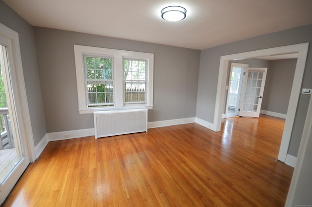 954 Birmingham St, Bridgeport, CT 06606 - spare room with radiator and light wood-style floors