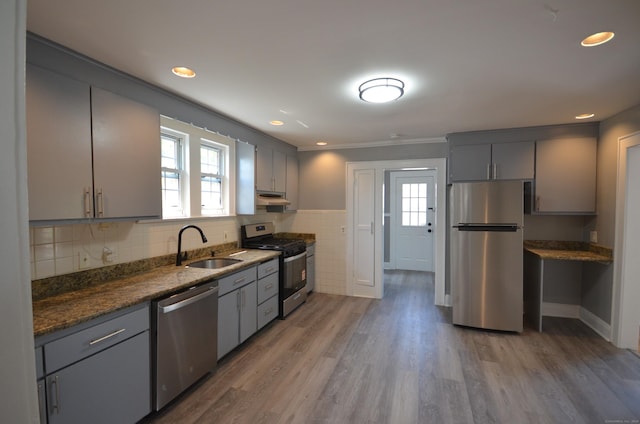 954 Birmingham St, Bridgeport, CT 06606 - kitchen featuring appliances with stainless steel finishes, gray cabinets, under cabinet range hood, light wood finished floors, and recessed lighting