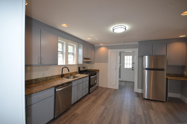 954 Birmingham St, Bridgeport, CT 06606 - kitchen with appliances with stainless steel finishes, gray cabinetry, under cabinet range hood, wood finished floors, and recessed lighting