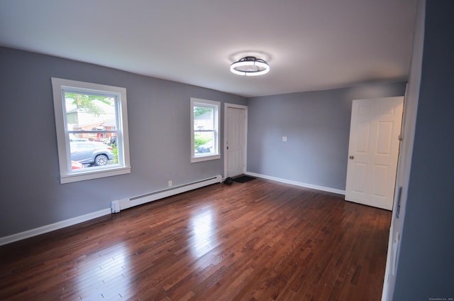 171 Wake St, Bridgeport, CT 06610 - unfurnished room featuring a baseboard radiator and dark wood-type flooring