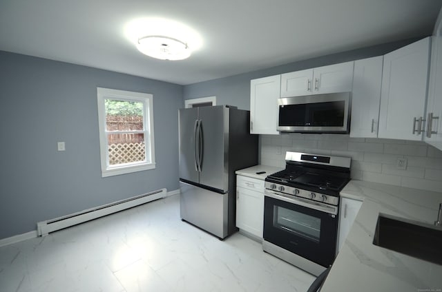 171 Wake St, Bridgeport, CT 06610 - kitchen featuring appliances with stainless steel finishes, baseboard heating, light marble finish floors, light stone counters, and white cabinetry