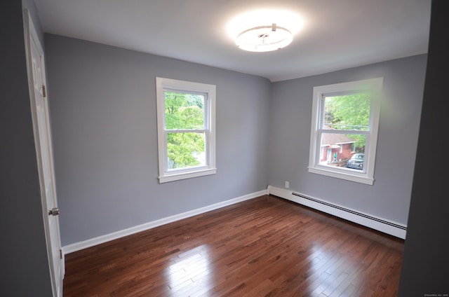 171 Wake St, Bridgeport, CT 06610 - unfurnished room with a baseboard radiator, plenty of natural light, and dark wood-style floors