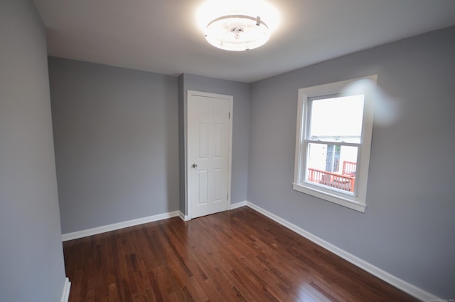 171 Wake St, Bridgeport, CT 06610 - empty room with dark wood-style flooring