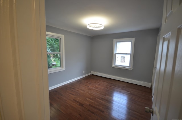 171 Wake St, Bridgeport, CT 06610 - spare room featuring baseboard heating and dark wood finished floors