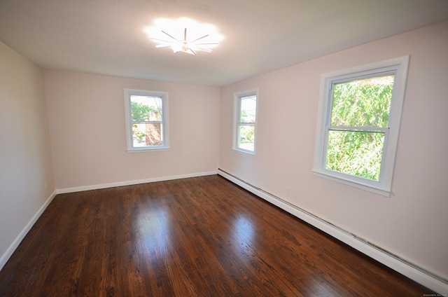 335 Wiklund Ave, Stratford, CT 06614 - spare room with a baseboard radiator, dark wood-type flooring, and a chandelier