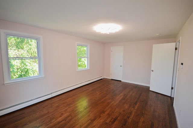335 Wiklund Ave, Stratford, CT 06614 - unfurnished bedroom with baseboard heating and wood finished floors