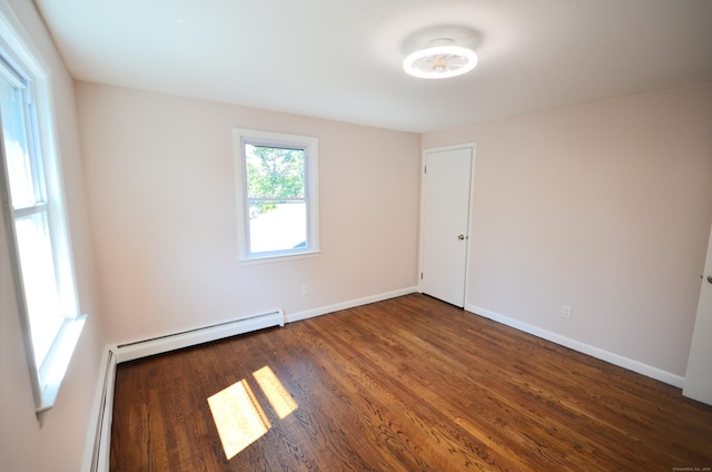 335 Wiklund Ave, Stratford, CT 06614 - unfurnished room featuring wood finished floors and baseboard heating